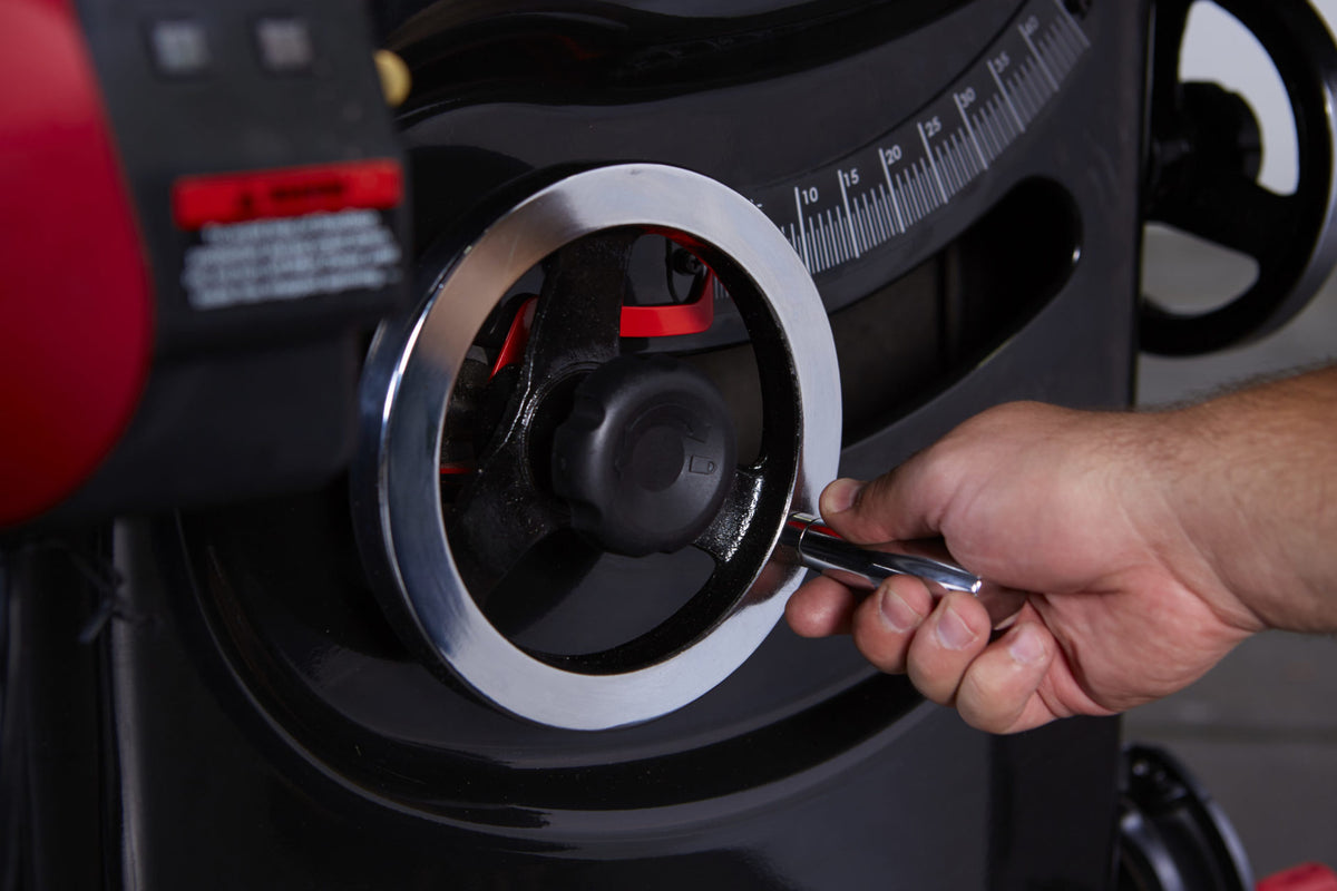 Cast iron blade tilt handwheel on the SawStop Professional Cabinet Saw